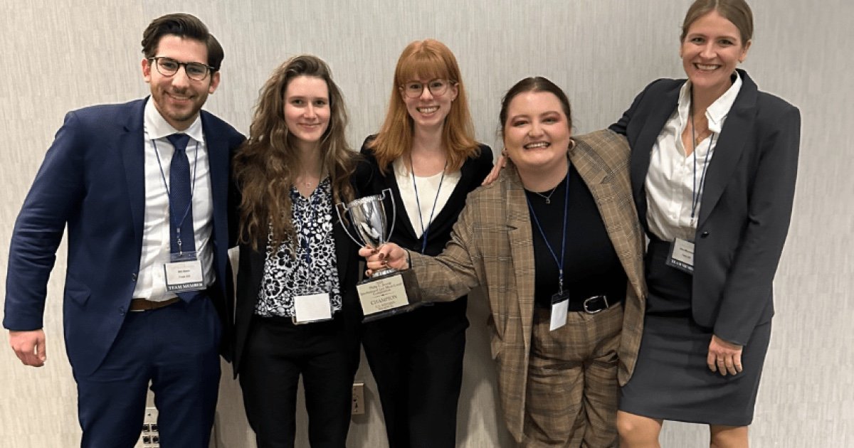 Case Western Reserve University School of Law championship Jessup team holding the trophy